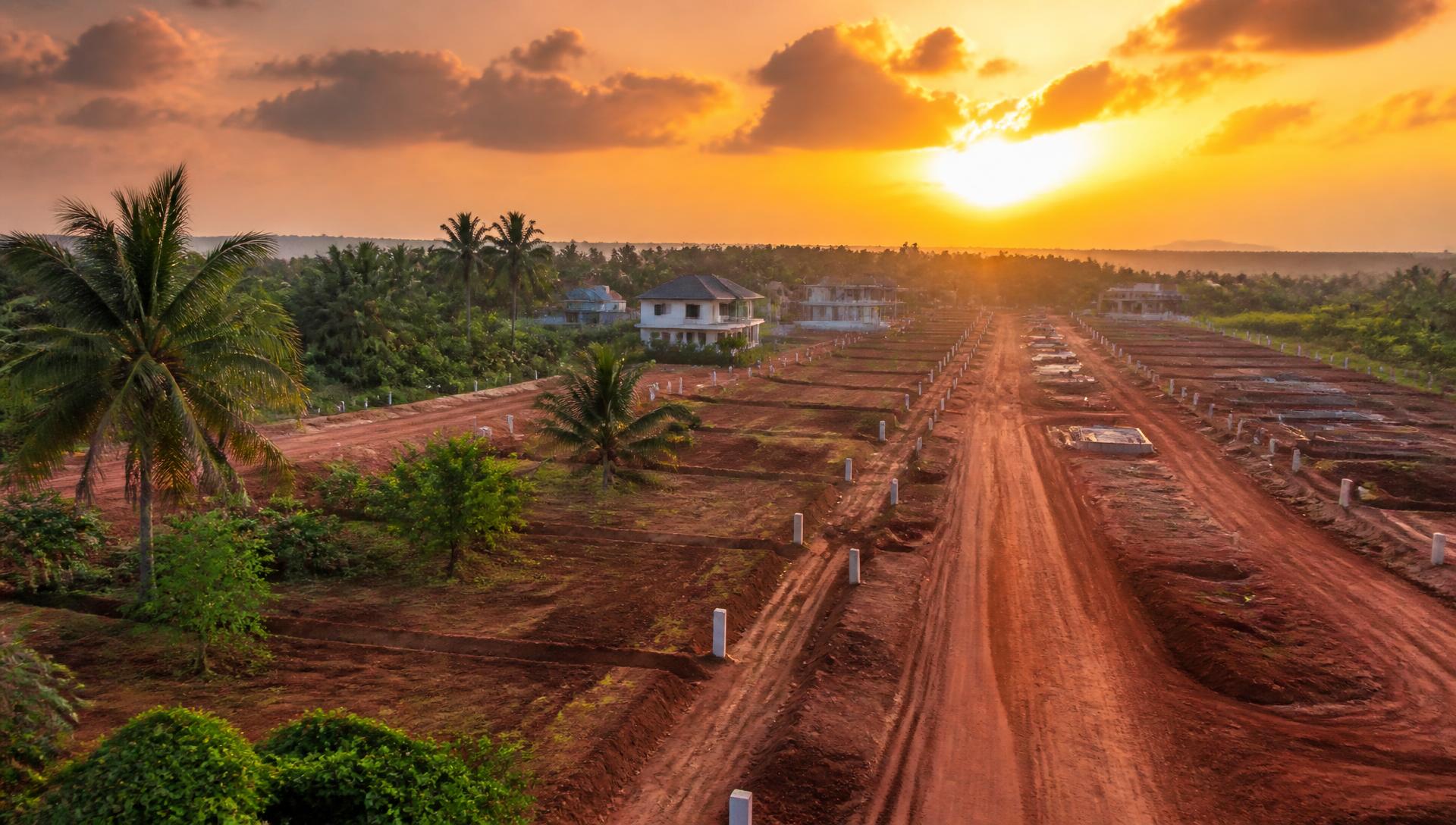 Surveyed land plots at a Dala Home Estate site at sunset